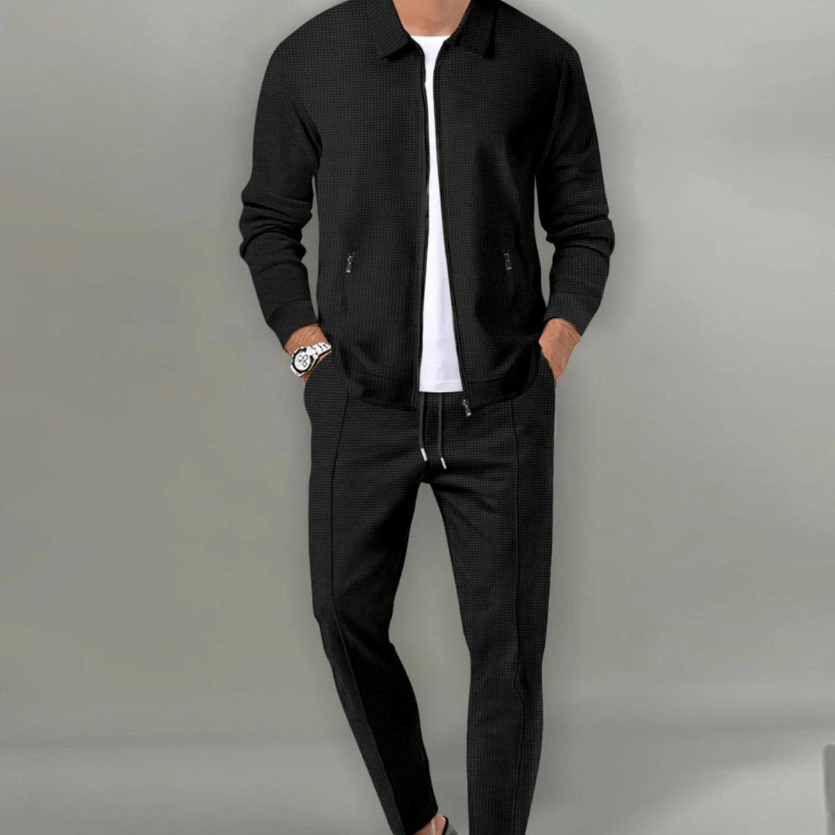 Men's slim-fit zip-up tracksuit in black with a drawstring waist