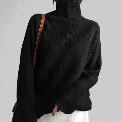 Black oversized diamond-knit turtleneck jumper, cosy autumn knitwear.