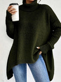 Women's dark green oversized cashmere longline jumper with a turtleneck, cosy knitwear.