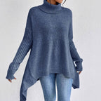 Women's apricot oversized cashmere longline jumper with a turtleneck, cosy knitwear.