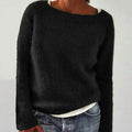 Black relaxed-fit knitted jumper with a crew neck, ideal for casual layering.