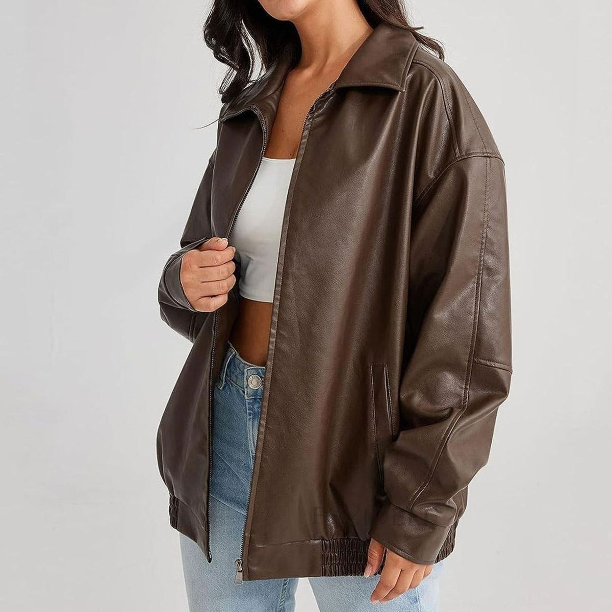 Women's oversized faux leather jacket in brown with a zip-up front and collar