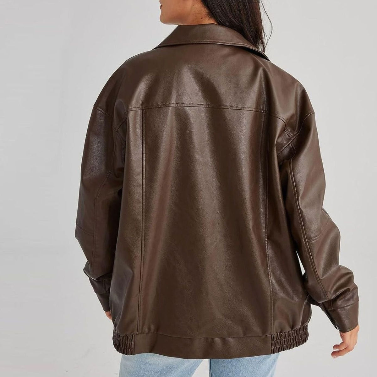 Women's oversized faux leather jacket in brown with a zip-up front and collar