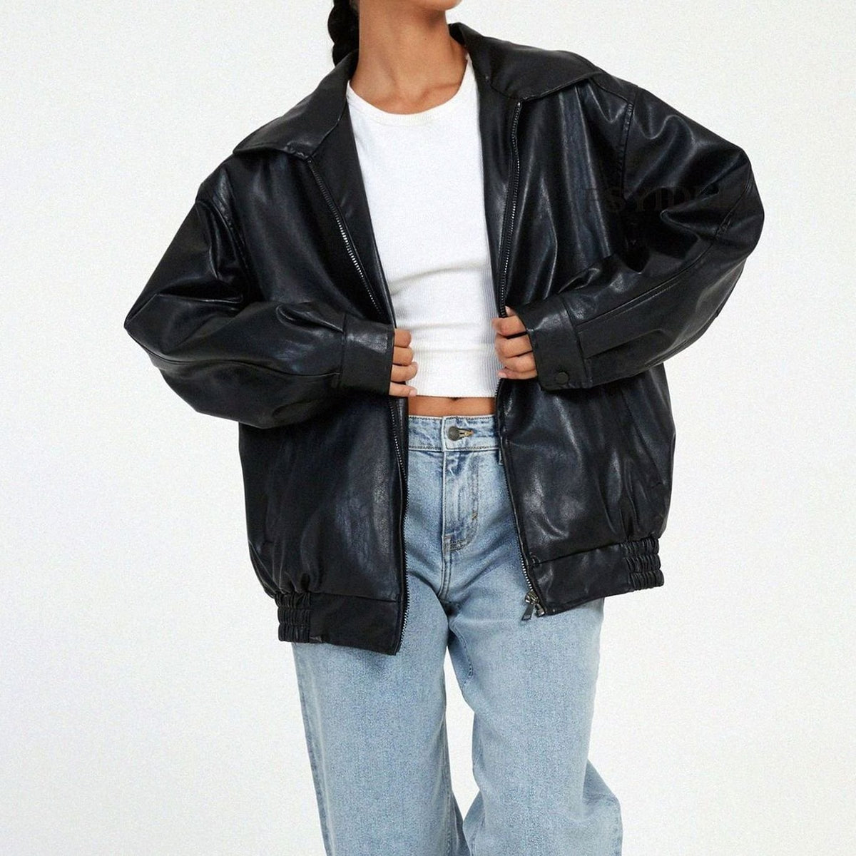 Women's oversized faux leather jacket in black with a zip-up front and collar
