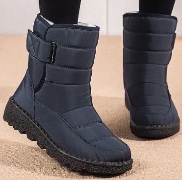 Red Waterproof quilted winter ankle boots for snow, styled product photo