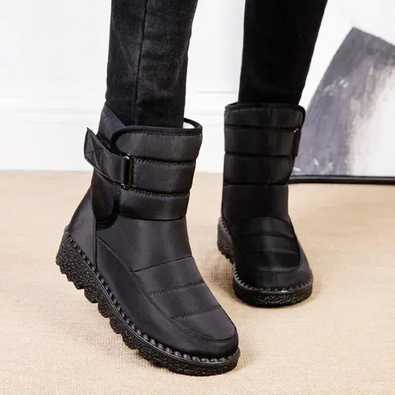 Red Waterproof quilted winter ankle boots for snow shown in a product photo