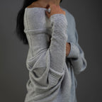 Product photo showing the light grey off-shoulder oversized jumper for cosy layering