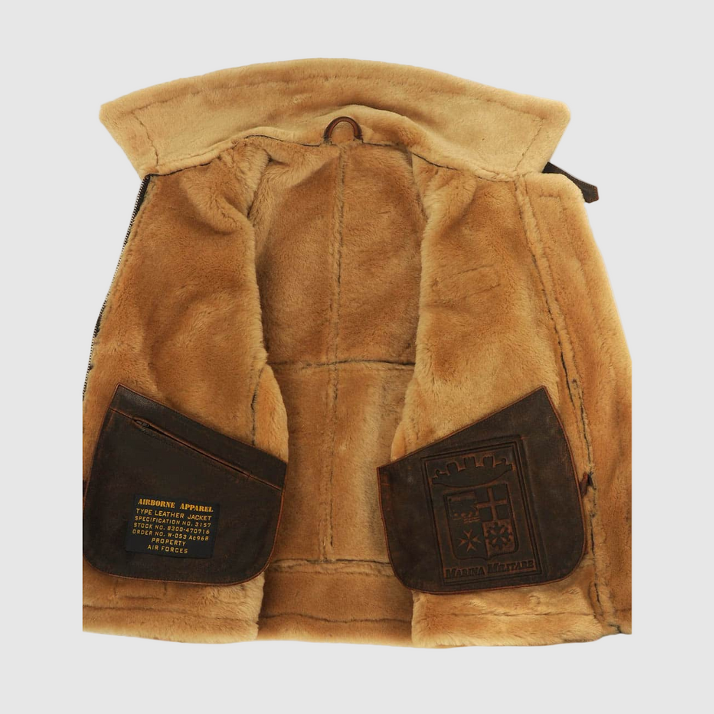 Brown aviator jacket interior lining, showing the soft shearling and side pockets.