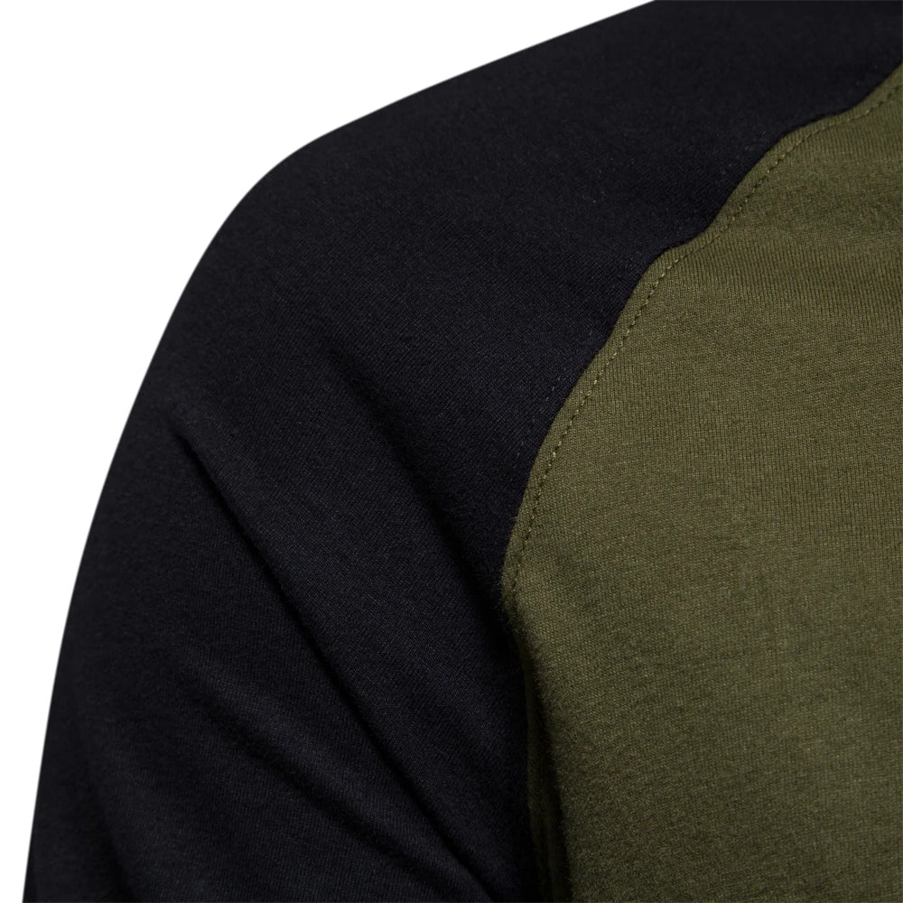 Green raglan long sleeve cotton t-shirt, close-up of the contrast sleeve seam