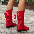 Product photo showing the black lace-up mid-calf block heel slouchy ankle boots