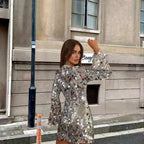 Silver Sparkling sequin long sleeve mini cocktail dress shown in a product photo