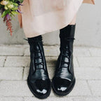 Black Lace-up leather cap-toe ankle boots for autumn shown in a product photo