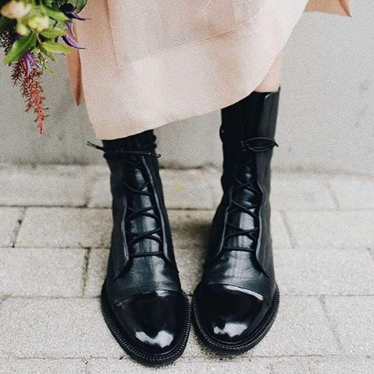 Black Lace-up leather cap-toe ankle boots for autumn shown in a product photo