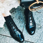 Black Lace-up leather cap-toe ankle boots for autumn pictured against a plain background
