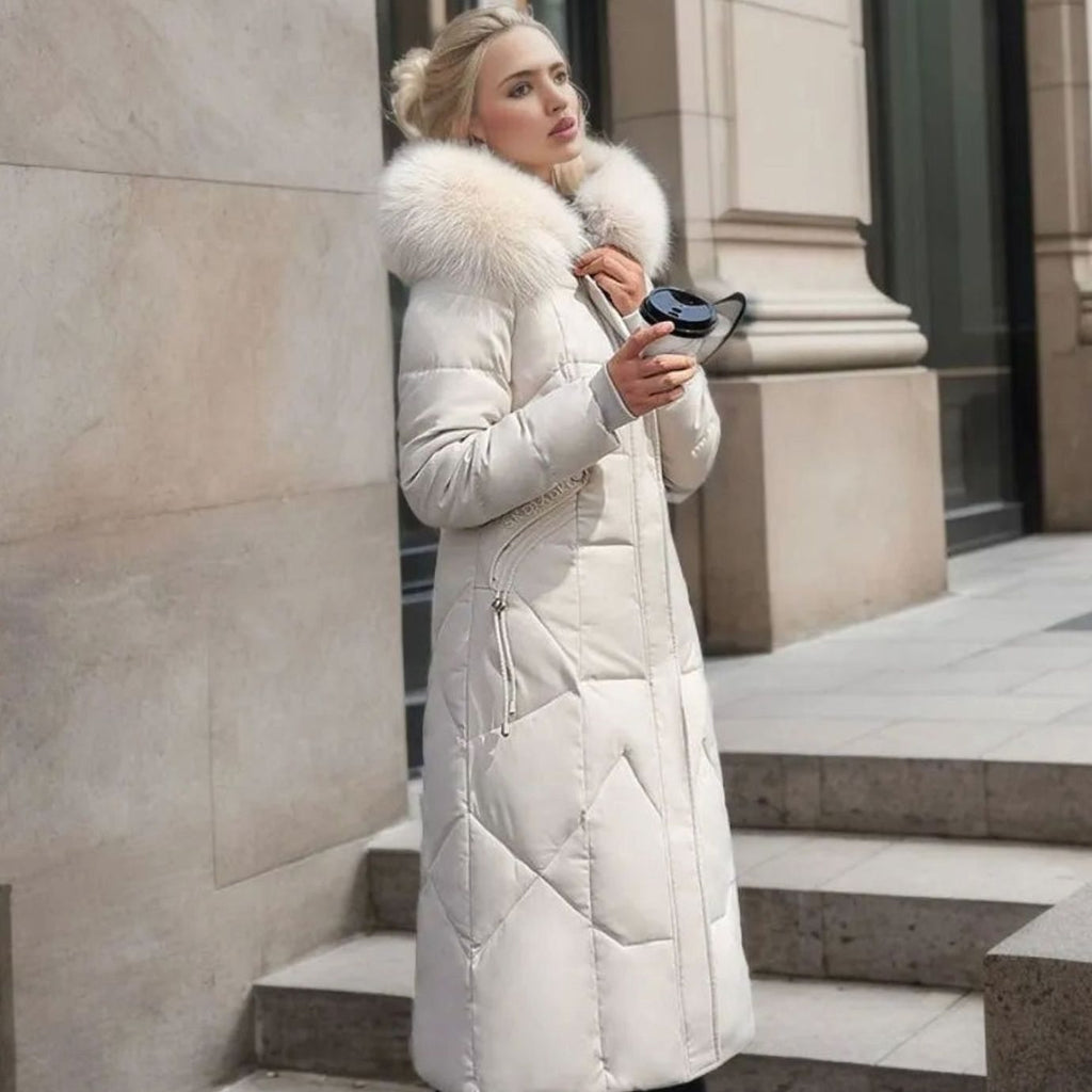White midi-length quilted coat, faux fur hood trim for a warm winter look.