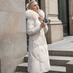 White midi-length quilted coat, faux fur hood trim for a warm winter look.