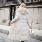White midi-length quilted coat, cosy faux fur hood trim and padded warmth.