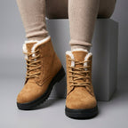 Red Fur-lined lace-up snow boots for icy days shown in a product photo