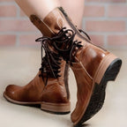 Brown lace-up mid-calf boots with block heel, close-up back view