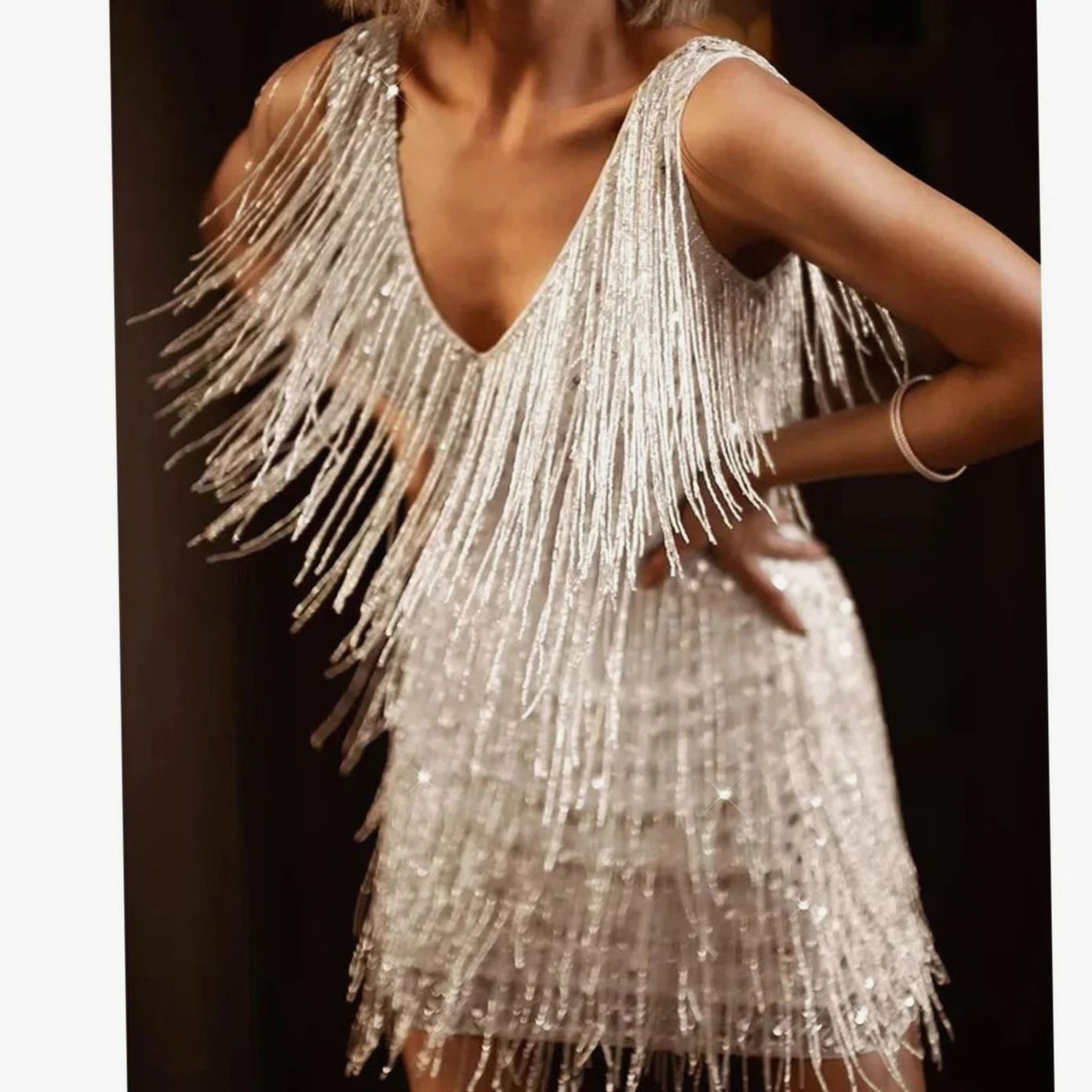 Women's sequin fringe mini cocktail dress in silver with a V-neck