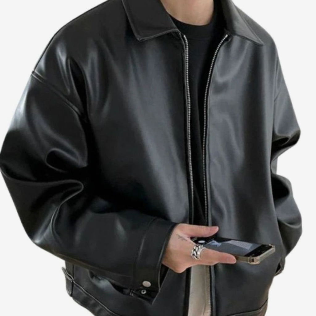 Men's black faux leather bomber jacket, oversized fit with buttoned cuffs.