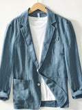 Blue cotton blazer for men with notch lapel and patch pockets, on hanger