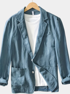 Blue cotton blazer for men with notch lapel, close-up of the lapel detail
