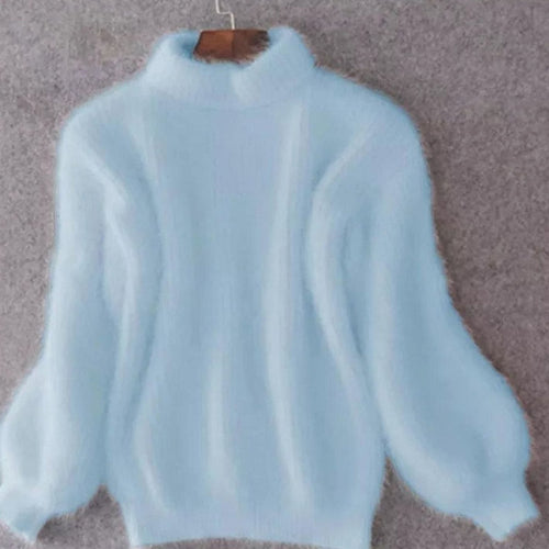 Women's blue relaxed-fit angora knit turtleneck sweater, cosy autumn style.
