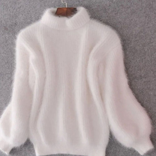 Women's white relaxed-fit angora knit turtleneck sweater, cosy autumn style.