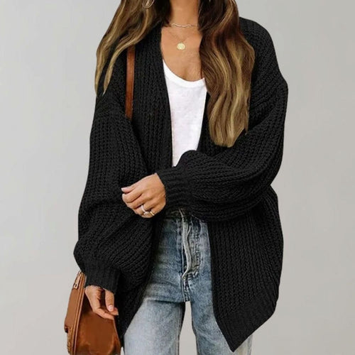 Black chunky knit cardigan with an open front, relaxed oversized fit for layering.