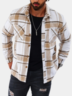 Men's plaid flannel overshirt in khaki, close-up of the chest pockets