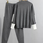 Grey knit jumper and jogger co-ord set styled together for a casual look.