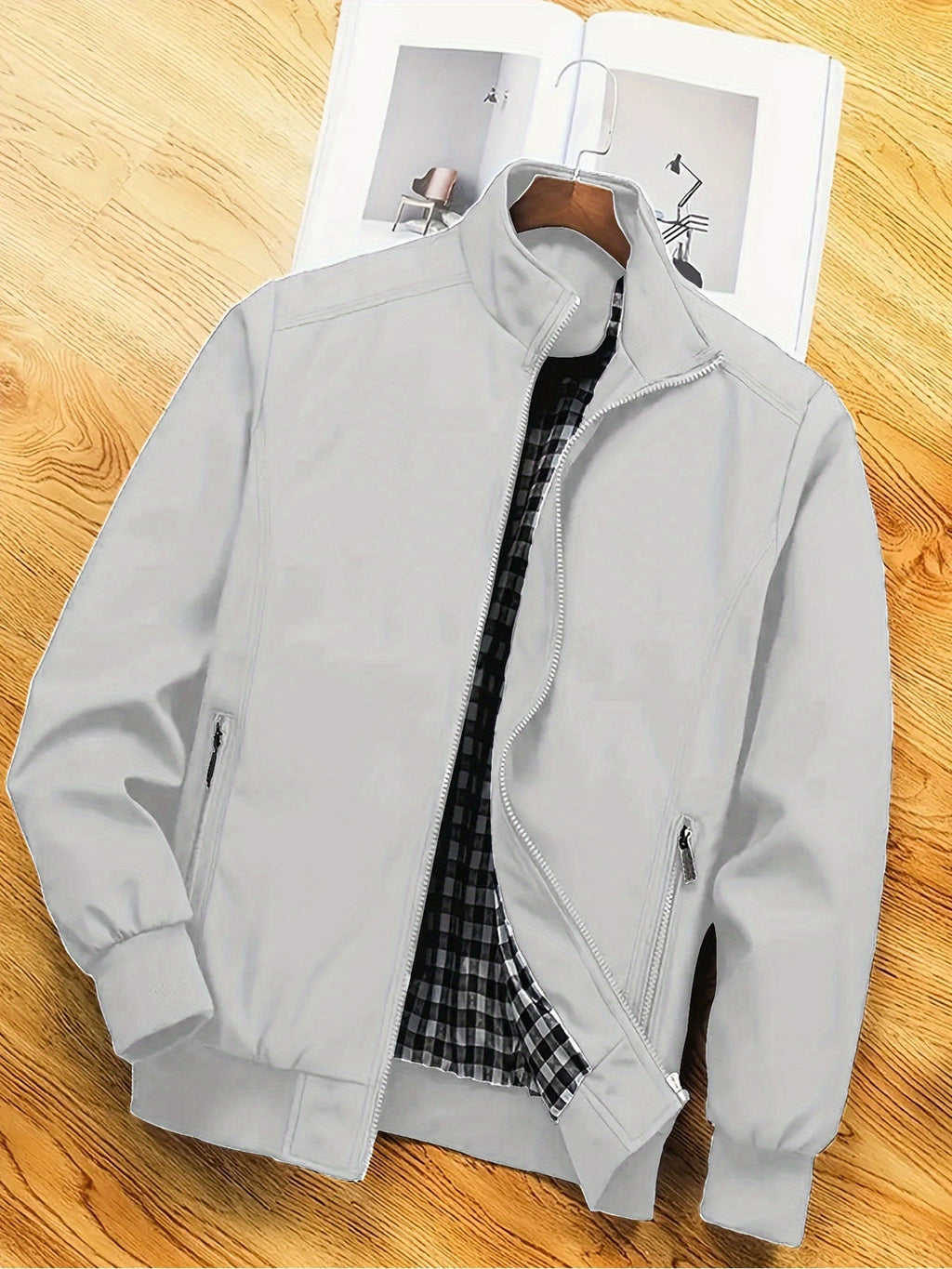 Grey regular-fit zip jacket with a stand collar, ideal for transitional layering.