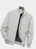 Grey regular-fit zip jacket with a stand collar, ideal for transitional layering.