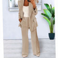 Beige trouser suit, long blazer and wide-leg trousers, front view