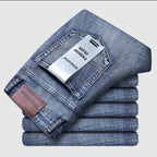 Blue stretch straight-fit jeans for men, folded flat-lay product shot