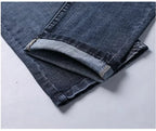 Navy blue stretch straight-fit jeans for men, close-up of the hem detail