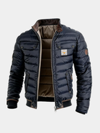 Men's quilted autumn jacket in navy blue, insulated with a high collar and pockets.