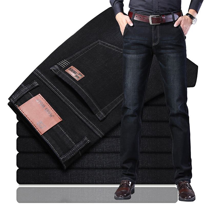 Black regular-fit straight-leg jeans in washed stretch denim, folded stack