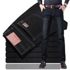 Black regular-fit straight-leg jeans in washed stretch denim, folded stack