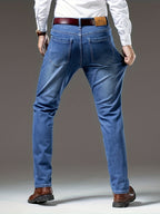 Blue regular-fit straight-leg jeans, back view in washed stretch denim