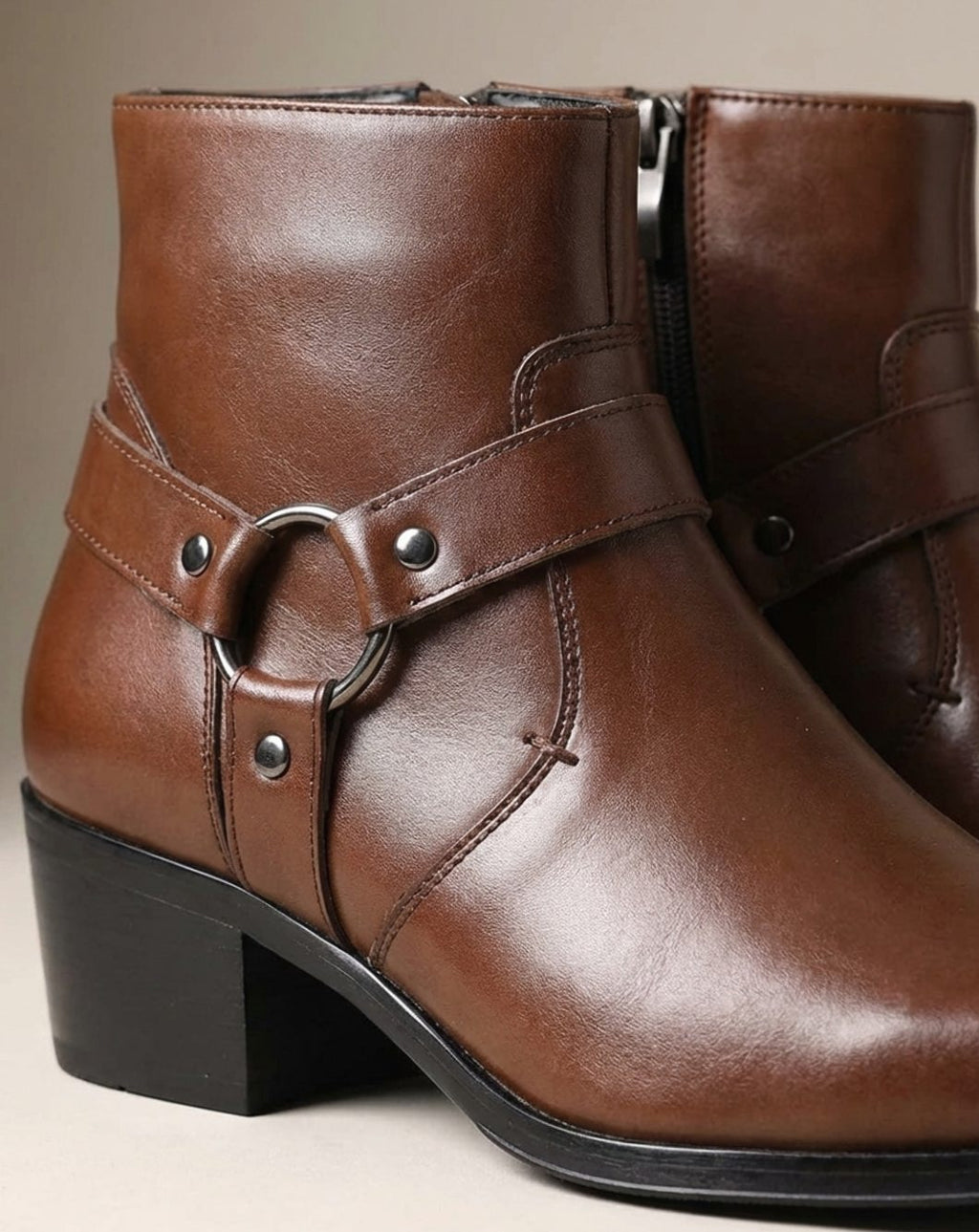 Product photo of the dark brown leather harness-strap pointed-toe ankle boots