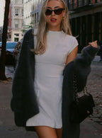 Product photo showing the black cap-sleeve formal mini dress for evening events