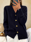 Women's black longline button-front cardigan with heart buttons