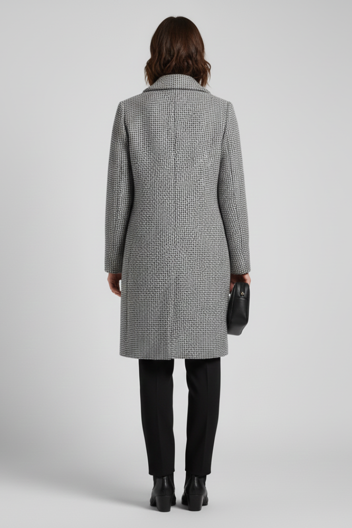 Grey tailored coat with hip-level side pockets, side view