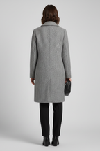 Grey tailored coat with hip-level side pockets, side view