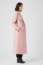 Women's pink long lapel-collar button-front overcoat, tailored style for autumn.