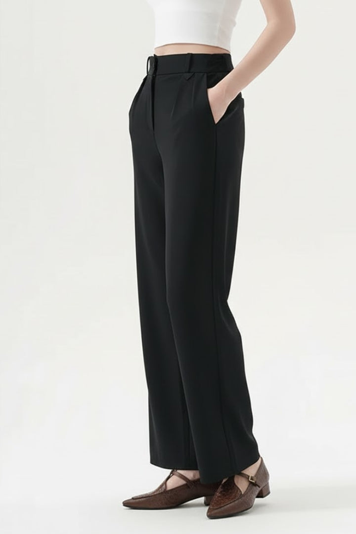 Black straight-leg trousers with a pleated waist, styled on the model
