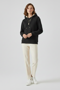 Women's fleece-lined pullover hoodie in black with ribbed cuffs
